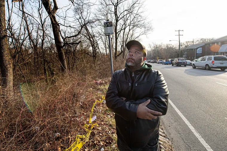 Stanley Kee is photographed near the location where his mother was killed in a hit-and-run in January after getting off of a bus stop in Philadelphia.