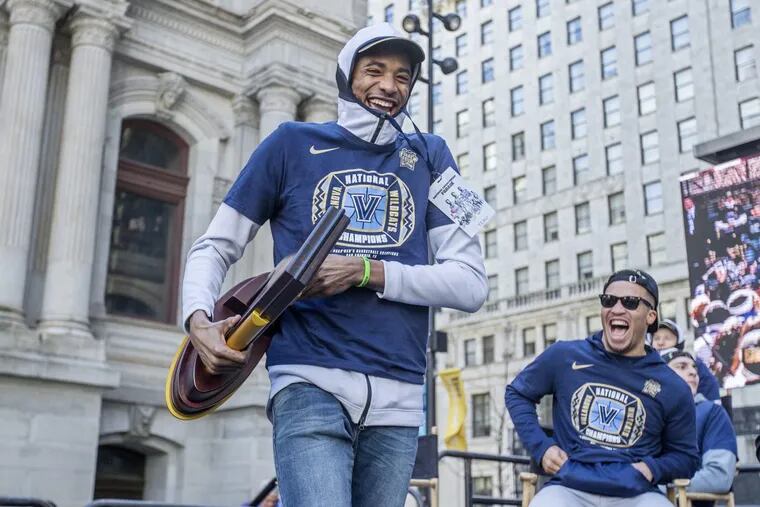 Mikal Bridges with the NCAA Championship trophy shares a laugh with Jalen Brunson at Villanova’s victory parade. The next move for Bridges is the NBA.