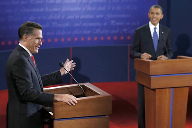 President Barack Obama listens as Republican presidential nominee Mitt Romney answers a question during the first presidential debate at the University of Denver, Wednesday, Oct. 3, 2012, in Denver. (AP Photo/Rick Wilking, Pool)