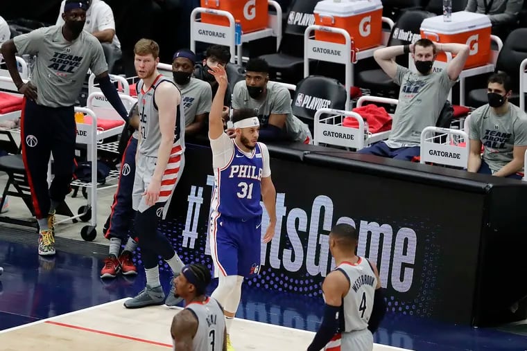 Sixers guard Seth Curry, who started the game, raises his arm after making a third-quarter three-point basket against the Washington Wizards in Game 3 of their first-round playoff series in Washington D.C., on Saturday, May 29, 2021.