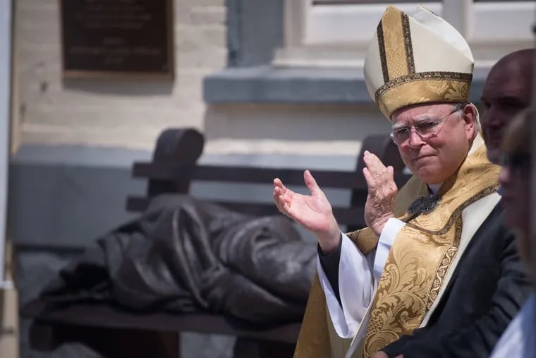 Archbishop Charles J. Chaput during the dedication of a “homeless Jesus” statue earlier this year.