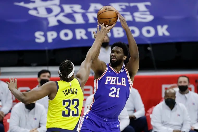 Sixers center Joel Embiid shoots the basketball past Indiana Pacers center Myles Turner on Monday, March 1, 2021 in Philadelphia.