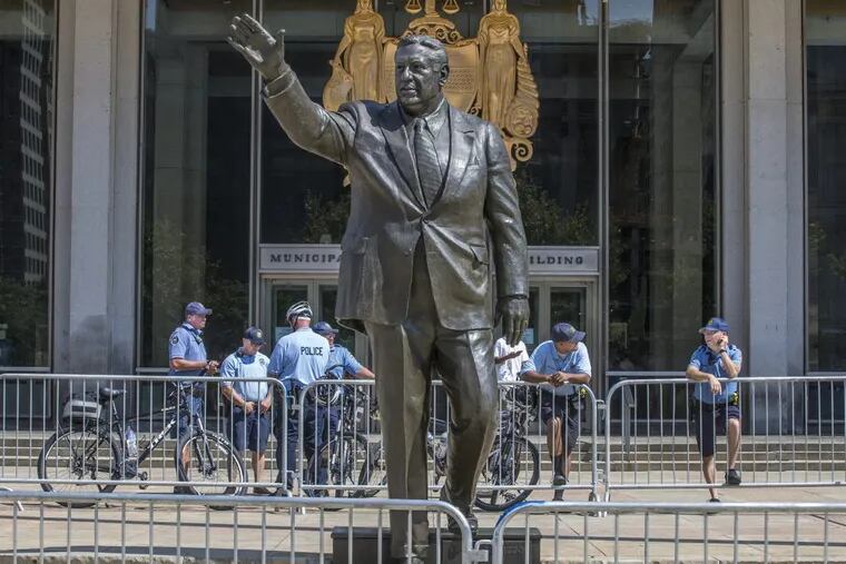 Philadelphia Police stand watch around the Frank Rizzo statue outside of the Municipal Service Building on JFK Blvd in center city Philadelphia on Thursday, August 17, 2017. This statue was egged by vandals.