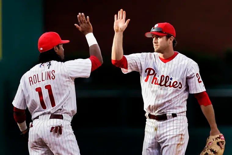 Phillies double play mates Jimmy Rollins and Chase Utley during a game against the Braves in April 2005.