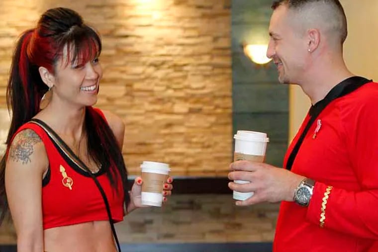 JTRECK27 - (From left) Michelle Yung, Aiden Rose,5 and Brad Rose from long Island ,NY are taking coffee break. They are dressed as Star Trek Mirror Mirror  epode on Mirror Universe.
04-26-2014( AKIRA SUWA  /  Staff Photographer ) 

Star Treck Convention at Crown Plaza Hotel