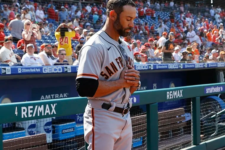 San Francisco Giants Manager Gabe Kapler stands with his eyes closed during the national anthem before the Phillies played the Giants on Monday.