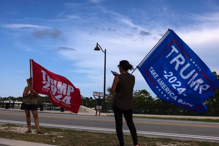 Trump supporters near his Mar-a-Lago estate Palm Beach, Fla., fly flags after his conviction.