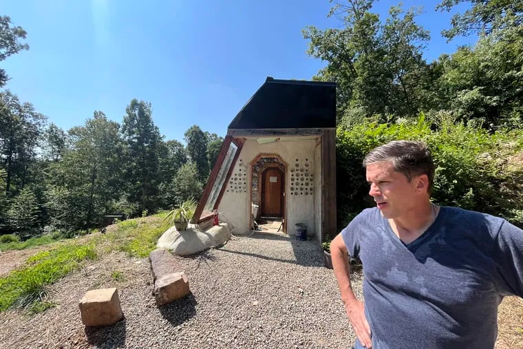 Will Vogler, an Ardmore resident, stands by a doorway to his unfinished Earthship in Tamaqua, Schuylkill County.