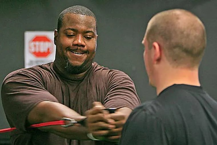 Jamaal Jackson works out with trainer Bobby Thompson at Power Train Sports in Cherry Hill, N.J. (Akira Suwa/Staff Photographer)
