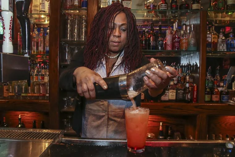 Bartender Augusta Mason makes “The Obama” drink at Parkside Beef &amp; Ale