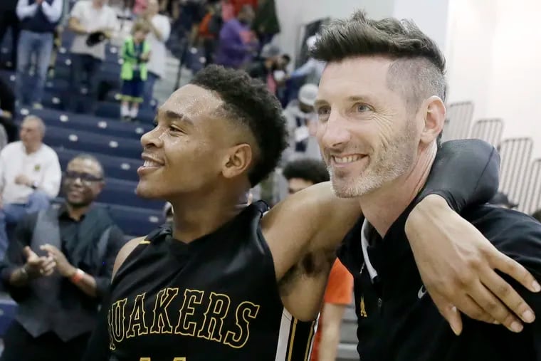 Moorestown # 11 Nick Cartwright-Atkins and head coach Shawn Anstey hug after the Ranney School vs Moorestown H.S. boys' basketball Tournament of Champions semirfinal at Toms River North H.S. on March 13, 2019.  Moorestown lost 62-40.
