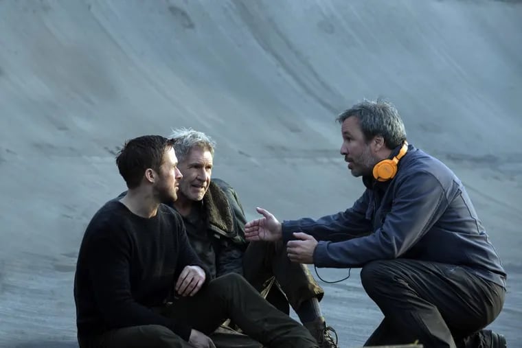 Ryan Gosling (from left), Harrison Ford, and director Denis Villenueve on the set of “Blade Runner 2049.”