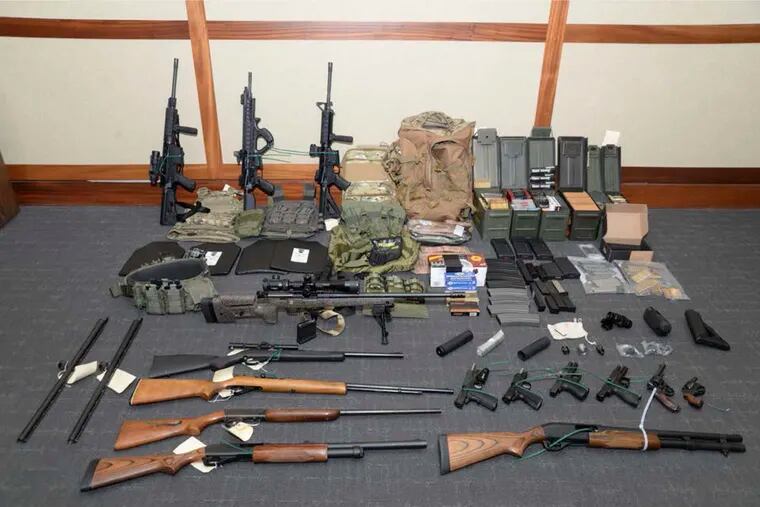 FILE - This image provided by the U.S. District Court in Maryland shows a photo of firearms and ammunition that was in the motion for detention pending trial in the case against Christopher Paul Hasson. (U.S. District Court via AP)