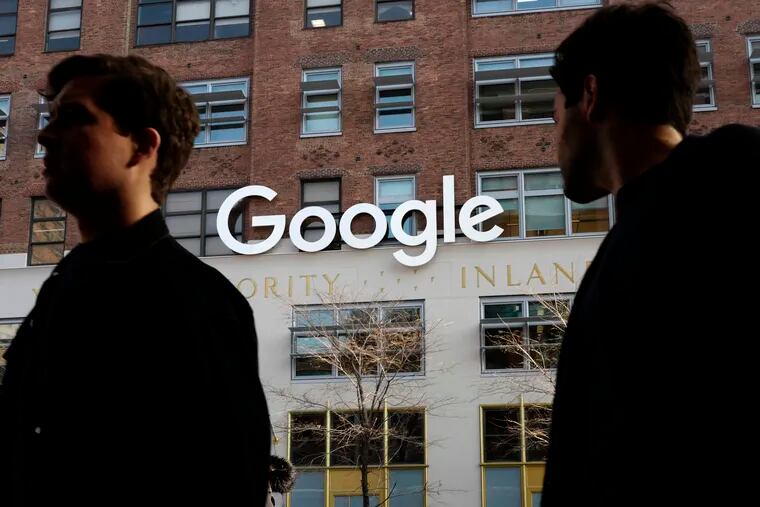 People walk by Google offices in New York. Google is closing the consumer version of its long-spurned Plus social network after discovering a bug earlier this year that leaked some of the personal information about up to 500,000 people who still have accounts on the dying service.