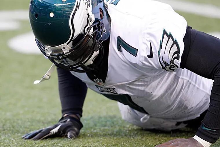 The Eagles' Michael Vick gets up from the turf during the second quarter
against the New York Giants on Sunday, December 30, 2012. (Yong Kim/Staff Photographer)