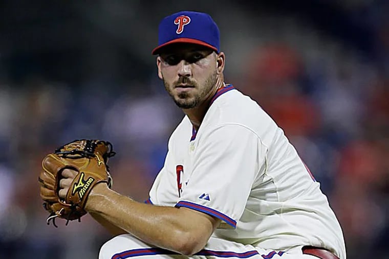 Phillippe Aumont wants to be the guy who takes the ball from the starting pitcher and hands it to a back-end reliever. (Matt Slocum/AP file photo)