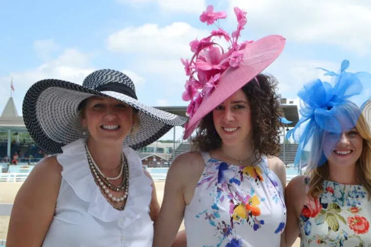 A colorful mix of hats atop (from left) Elizabeth Hunt, Gabrielle Aruta, Priscilla Person, and Meg Cinelli at the 2015 Ladies Day Hat Contest.