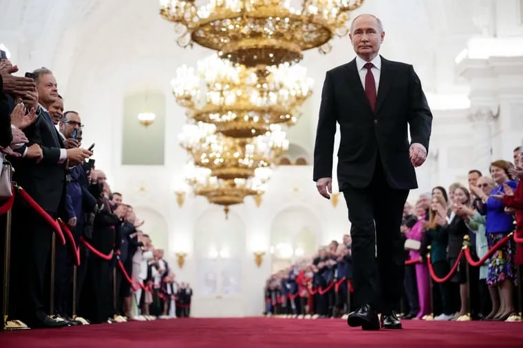 Vladimir Putin walks to take his oath as Russian president during an inauguration ceremony in the Grand Kremlin Palace in Moscow on Tuesday.