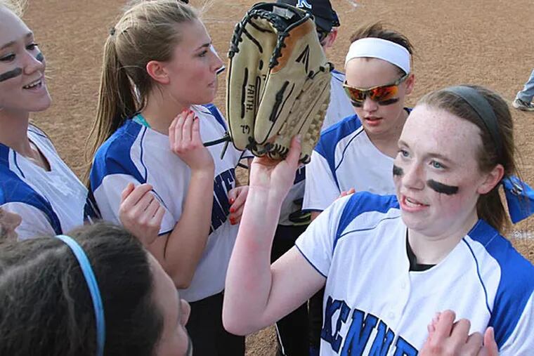 Pitcher Brooke Harner, right, of Kennett is congratulated by teammates
after the final out in their game against West Chester Rustin at
Kennett on May 2, 2014.  Kennett rallied from behind in the 6th inning
and won 9-7.   ( CHARLES FOX / Staff Photographer )