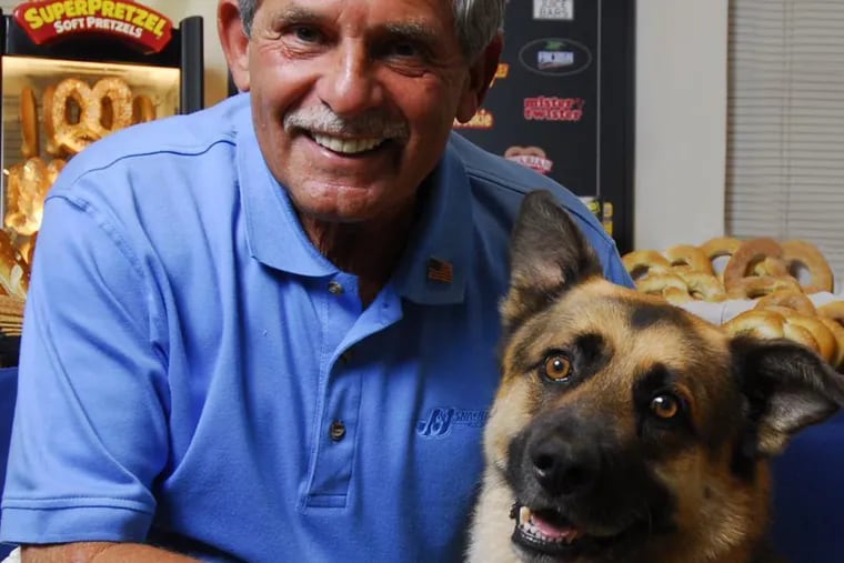 Gerald Shreiber, president and CEO of J&J Snack Foods Corp. of Pennsauken, photographed with canine friend Teddy, has gifted $3 million to Rowan University to start a new therapy dog program.