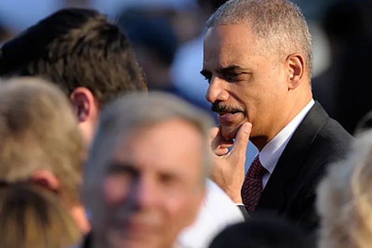Attorney General Eric Holder attends the congressional picnic at the White House Wednesday, the day before the House of Representatives voted to hold him in contempt of Congress. (Susan Walsh / Associated Press)