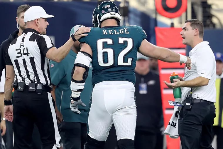 Eagles center Jason Kelce didn't want to come off the field after he was banged-up on a play in the 2nd quarter against the Cowboys. Philadelphia Eagles play the Dallas Cowboys in Arlington, TX on December 9, 2018.  DAVID MAIALETTI / Staff Photographer