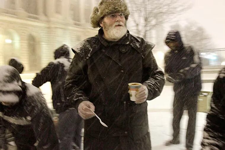 Cranford Coulter of Souderton serves his homemade soup to hungry people along Vine Street between 18th and 19th Streets during a visit this year. (Elizabeth Robertson/Staff/File)