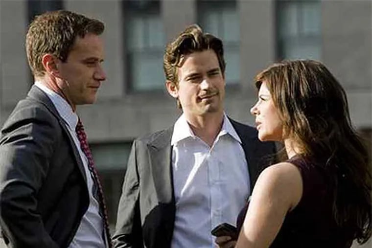 Tim DeKay (left) plays the FBI-agent hero, Peter Burke, in "White Collar," Tiffani Thiessen is his wife, and Matt Bomer is the scam artist who avoids prison by helping the agent. The show will be more fun for folks who can fast-forward through the plethora of commercials. (David Giesbrecht / USA Network)
