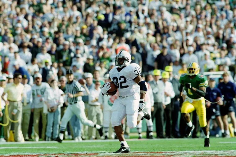 Penn State's Ki-Jana Carter (32) is chased by Oregon's Alex Molden (1) as he heads for the end zone on the Nittany Lions' first possession of the 81st Rose Bowl against Oregon in Pasadena, Ca., Monday, Jan. 2, 1995.  (AP Photo/Reed Saxon)