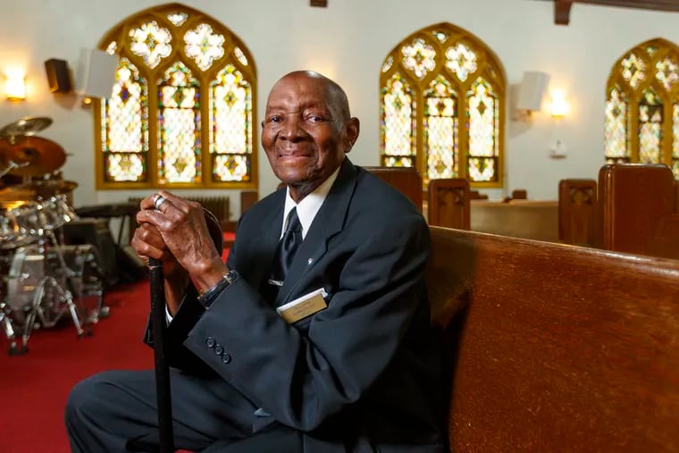 Clarence Walker, 97, is an usher for Sunday services at Holy Cross Baptist Church in Overbrook and a World War II veteran.