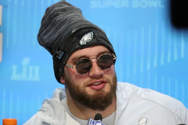 Lane Johnson, shown at Super Bowl media night, has a restructured contract with the Eagles.