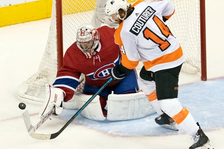 Montreal Canadiens goaltender Carey Price makes a save on Flyers center Sean Couturier (14) during Friday's playoff game in Toronto. The Flyers won, 3-2, and captured the series, four games to two.