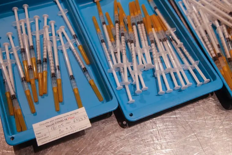 Syringes with the Pfizer COVID-19 vaccine at a vaccination center in Paris.