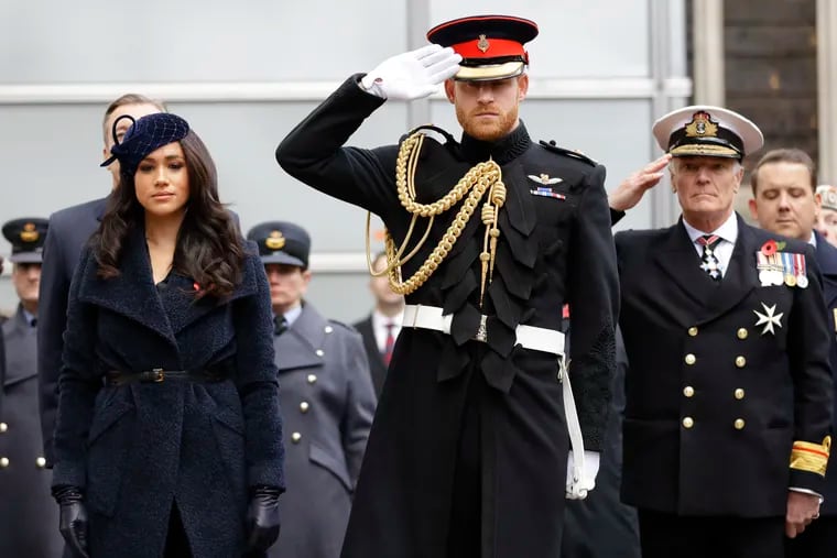 FILE - In this Thursday, Nov. 7, 2019 file photo, Britain's Prince Harry and Meghan, the Duchess of Sussex attend the 91st Field of Remembrance at Westminster Abbey in London. Prince Harry and his wife, Meghan, are fulfilling their last royal commitment Monday March 9, 2020 when they appear at the annual Commonwealth Service at Westminster Abbey. It is the last time they will be seen at work with the entire Windsor clan before they fly off into self-imposed exile in North America. (AP Photo/Kirsty Wigglesworth, file)