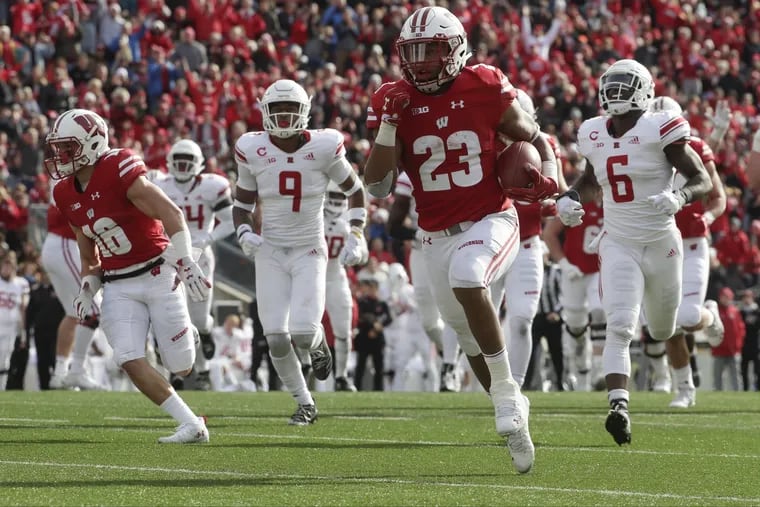 Wisconsin's Jonathan Taylor runs for a touchdown during the second half of an NCAA college football game against Rutgers Saturday, Nov. 3, 2018, in Madison, Wis.
