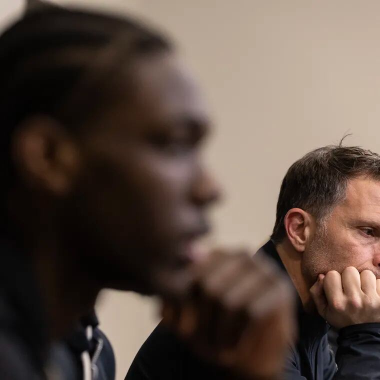Rasheer Fleming, left, and coach Billy Lange of St. Joseph's in their press conference following their loss to VCU in a semifinal game in the Atlantic 10 Basketball Tournament on March 16, 2024.