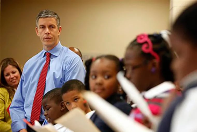U.S. Education Secretary Arne Duncan listens to fourth graders read at Delaplaine McDaniel Elementary School in Philadelphia on Sept. 29, 2009. Duncan announced the Race to the Top competition for funds yesterday. (AP Photo/Matt Rourke, FILE)