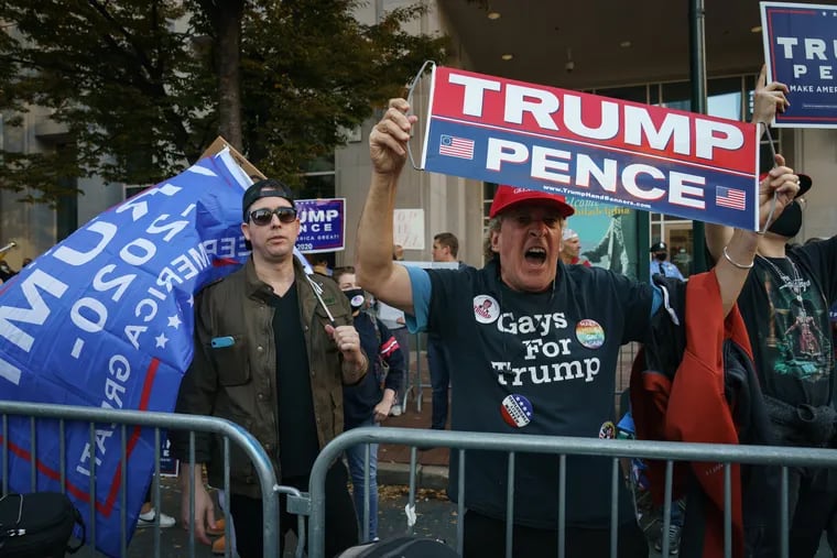 Trump supporters gather Saturday outside of the Pennsylvania Convention Center in Philadelphia after the presidential race was called for Joe Biden.