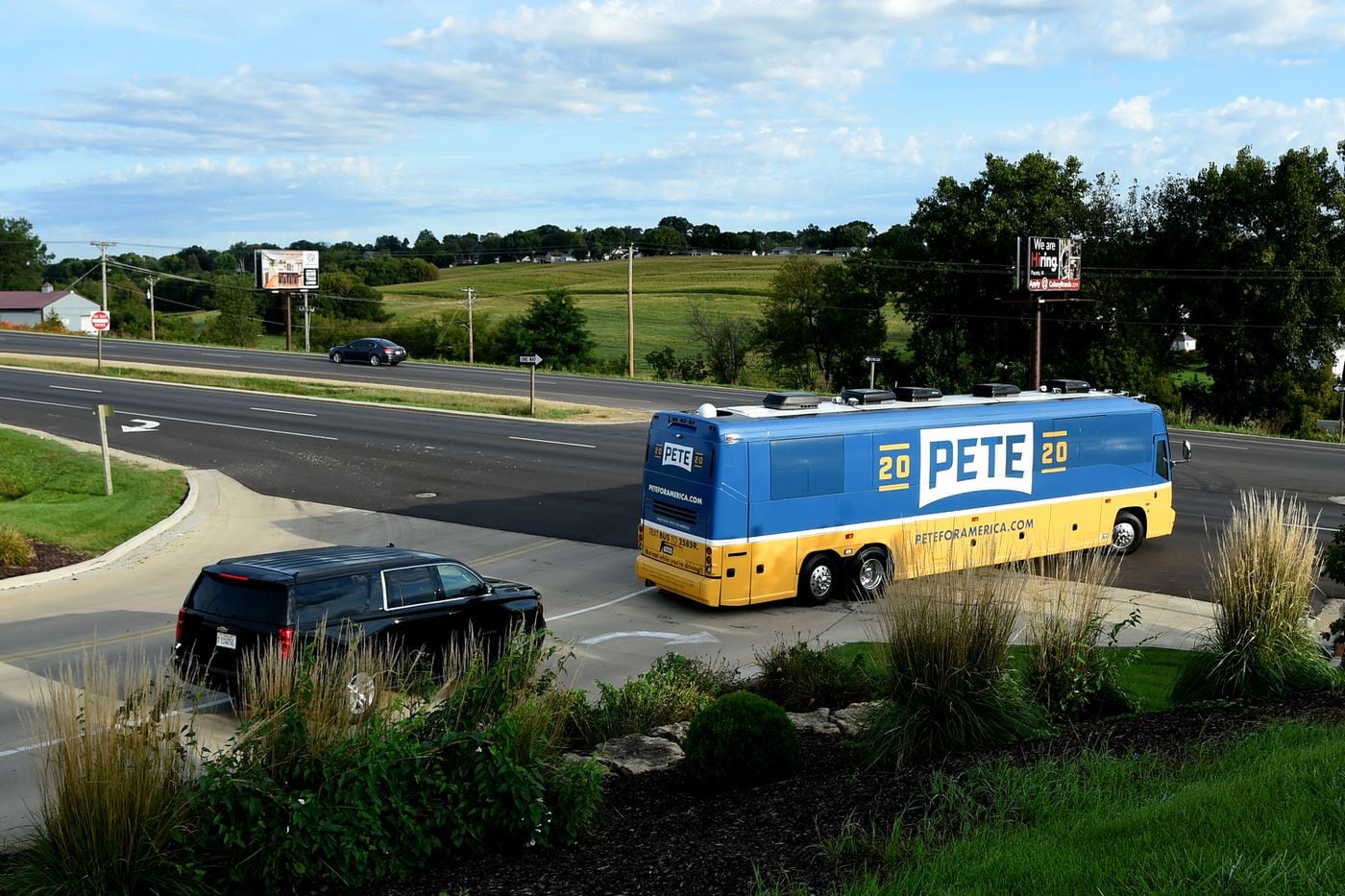 The bus of Democratic presidential candidate Mayor Pete Buttigieg leaves his motel in Dubuque, Iowa in the early morning September 24, 2019 on the final leg of his four-day, on-the-record bus tour with reporters.