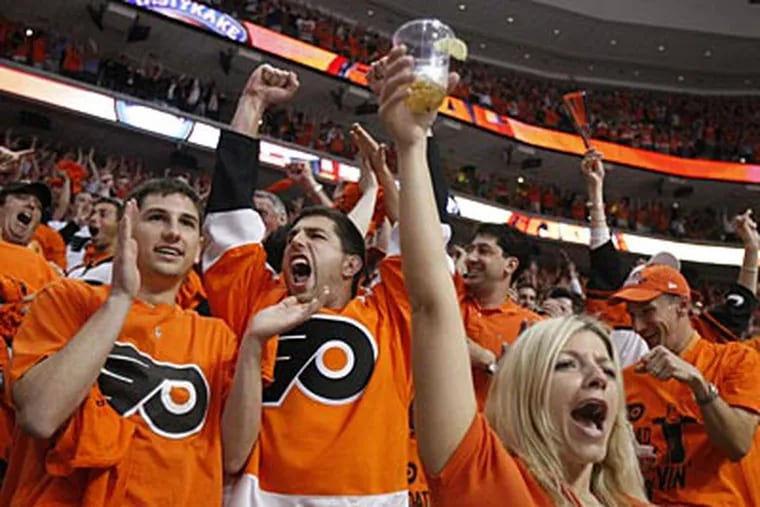 Fans celebrate during Game 3 of the Stanley Cup Finals. The Flyers won, 4-3, in overtime. (Ron Cortes / Staff Photographer)