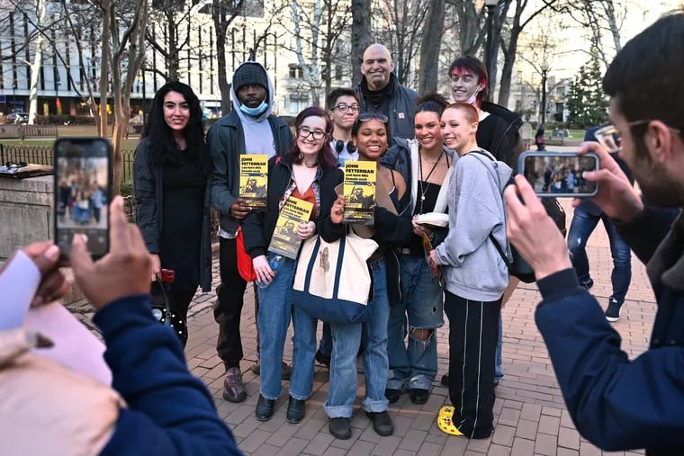 Then-Lt. Gov. John Fetterman (center, rear) and his wife, Gisele Barreto Fetterman (far left), pose with students from the Philadelphia High School for Creative and Performing Arts (CAPA) in Rittenhouse Square on March 2, 2022.