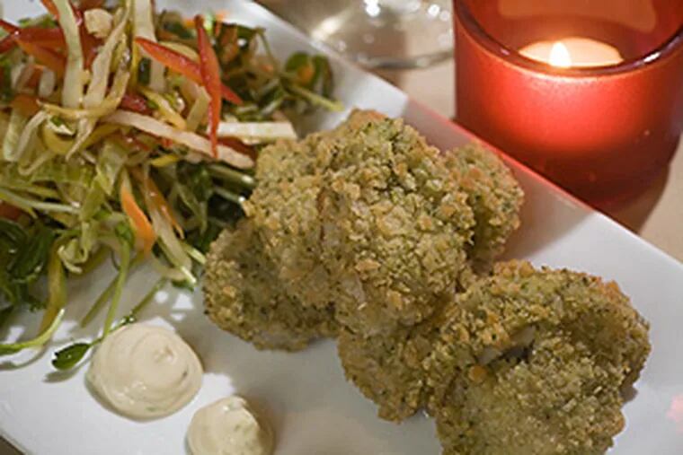 Fried oysters with fiery slaw, as served at Chesham Cottage. Readers of a recent review wondered how positive remarks about the Mount Airy restaurant translated into only a single bell in Craig LaBan's rating system.