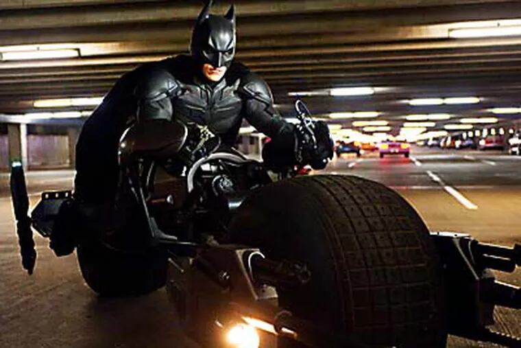 This undated film image released by Warner Bros. Pictures shows Christian Bale as Batman in a scene from the action thriller "The Dark Knight Rises." (AP Photo/Warner Bros. Pictures, Ron Phillips)