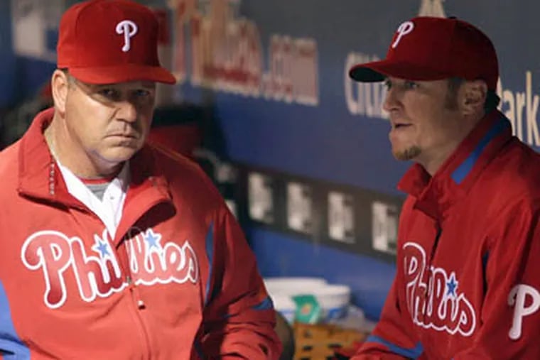 Former Phillies pitching coach Rich Dubee, left, talks with right-hander Brett Myers in the dugout during a game in 2009.