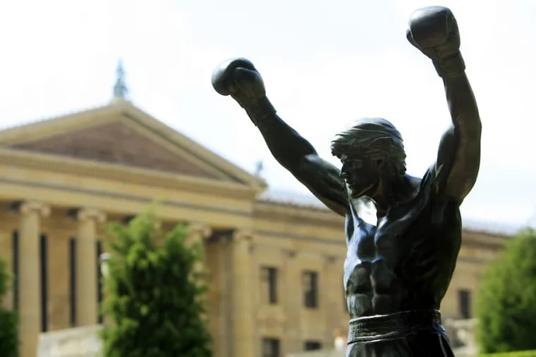 FILE photo shows the Rocky statue outside the Philadelphia Museum of Art. Vanguard chief economist used a boxing analogy to describe his outlook for the U.S. economy -- down but not out.