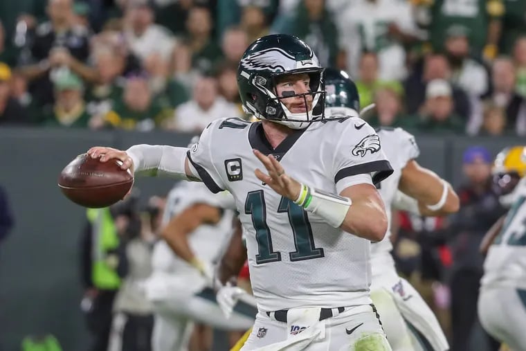 Eagles quarterback Carson Wentz looks to throw the ball downfield in last week's 34-27 win over the Packers. Wentz and the Eagles will face the Jets on Sunday at Lincoln Financial Field.