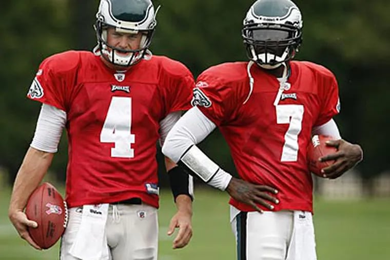 Once upon a time, Michael Vick (right) served as Kevin Kolb's (left) backup. (David Maialetti/Staff file photo)