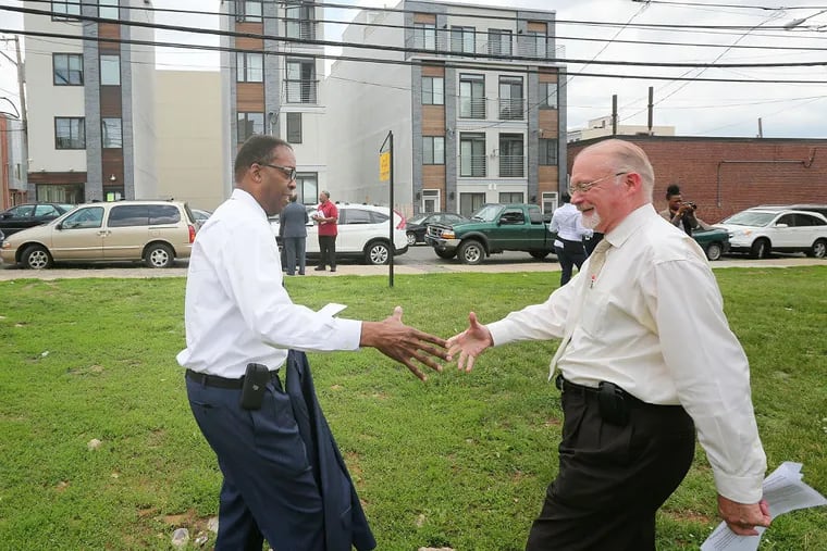 City Councilman Bill Greenlee (right) yesterday with City Council President Darrell Clarke on the vacant lot in Francisville. (David Swanson/Staff Photographer)