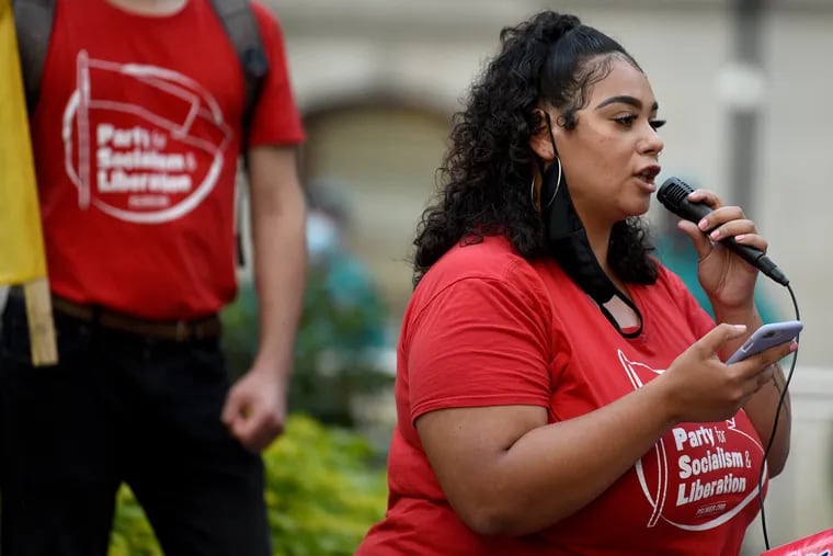 Talia Giles, 25, of Philadelphia, speaks during a Party for Socialism and Liberation rally on Sept. 23 outside City Hall in Philadelphia.