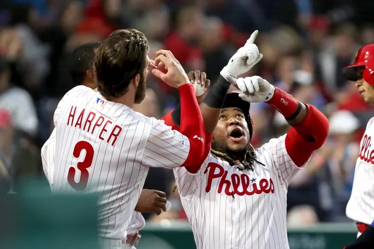 Maikel Franco, right, and Bryce Harper celebrating after Franco's three-run homer against the Mets, part of a 10-run first inning.